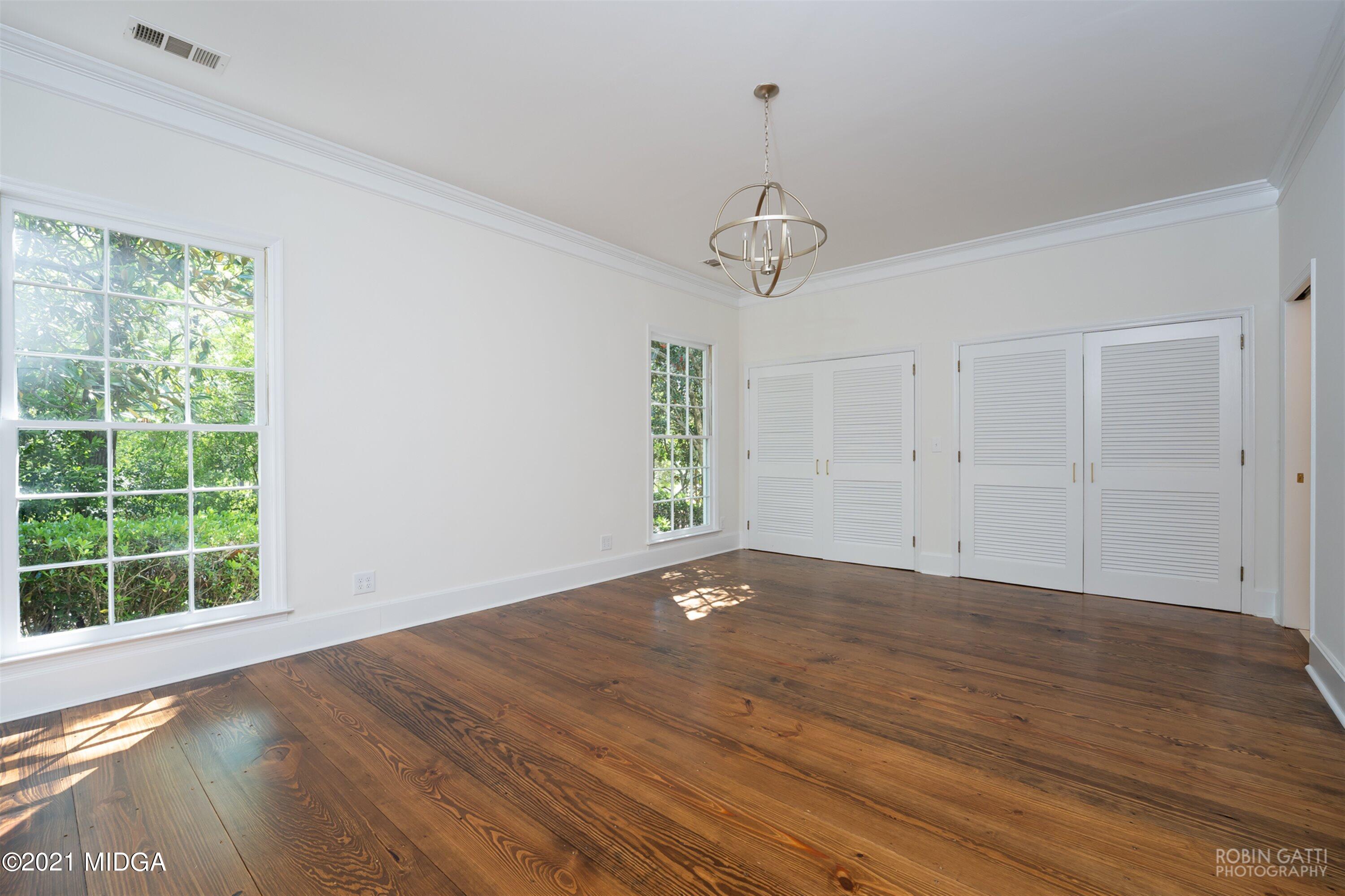2569 Maynards Mill Road Forsyth, GA 31029 - Photo 33 of 67 a view of an empty room with wooden floor and a window