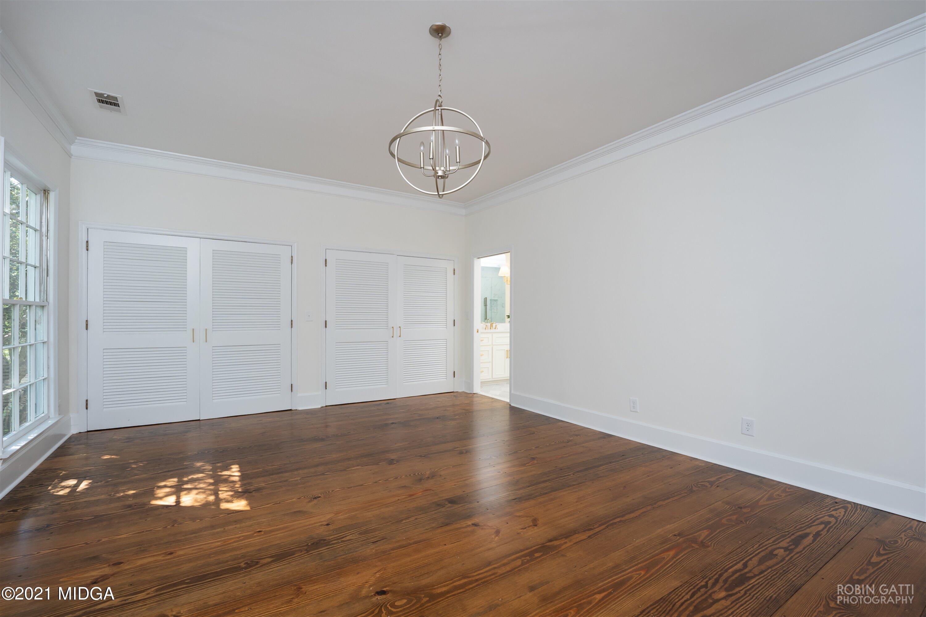 2569 Maynards Mill Road Forsyth, GA 31029 - Photo 34 of 67 a view of a room with wooden floor and window