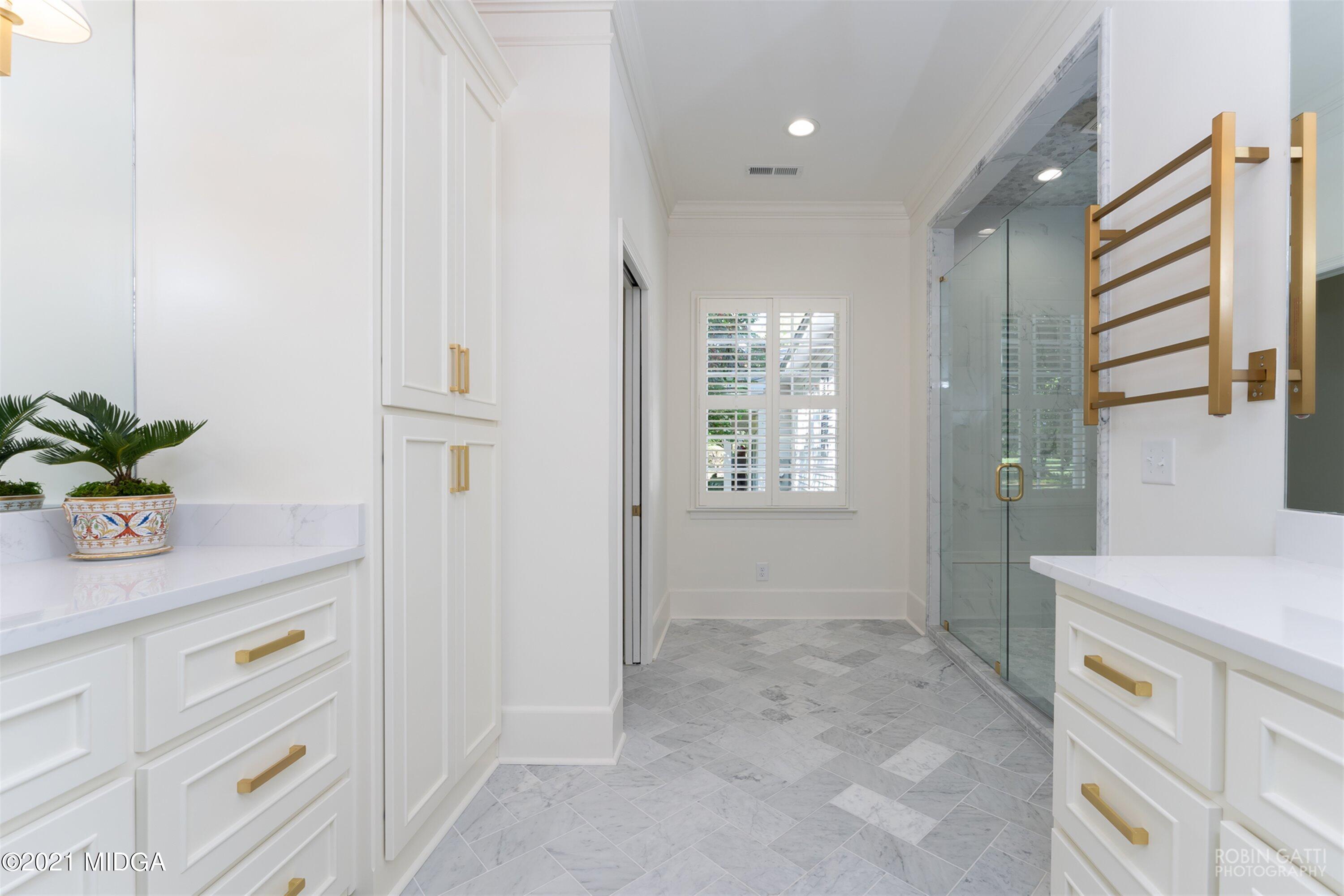2569 Maynards Mill Road Forsyth, GA 31029 - Photo 35 of 67 a bathroom with a sink a vanity and a mirror