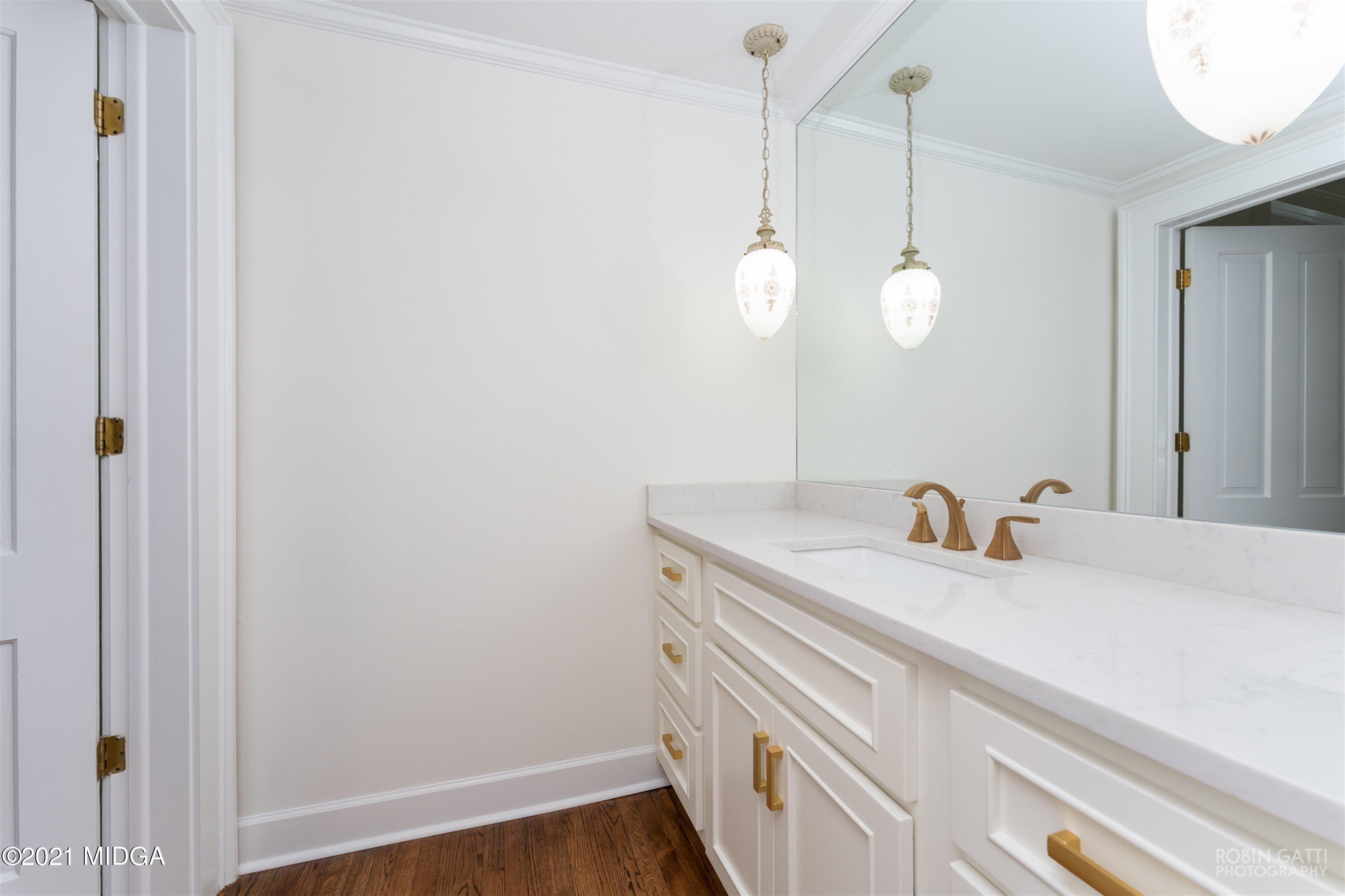 2569 Maynards Mill Road Forsyth, GA 31029 - Photo 45 of 67 a bathroom with a sink and mirror