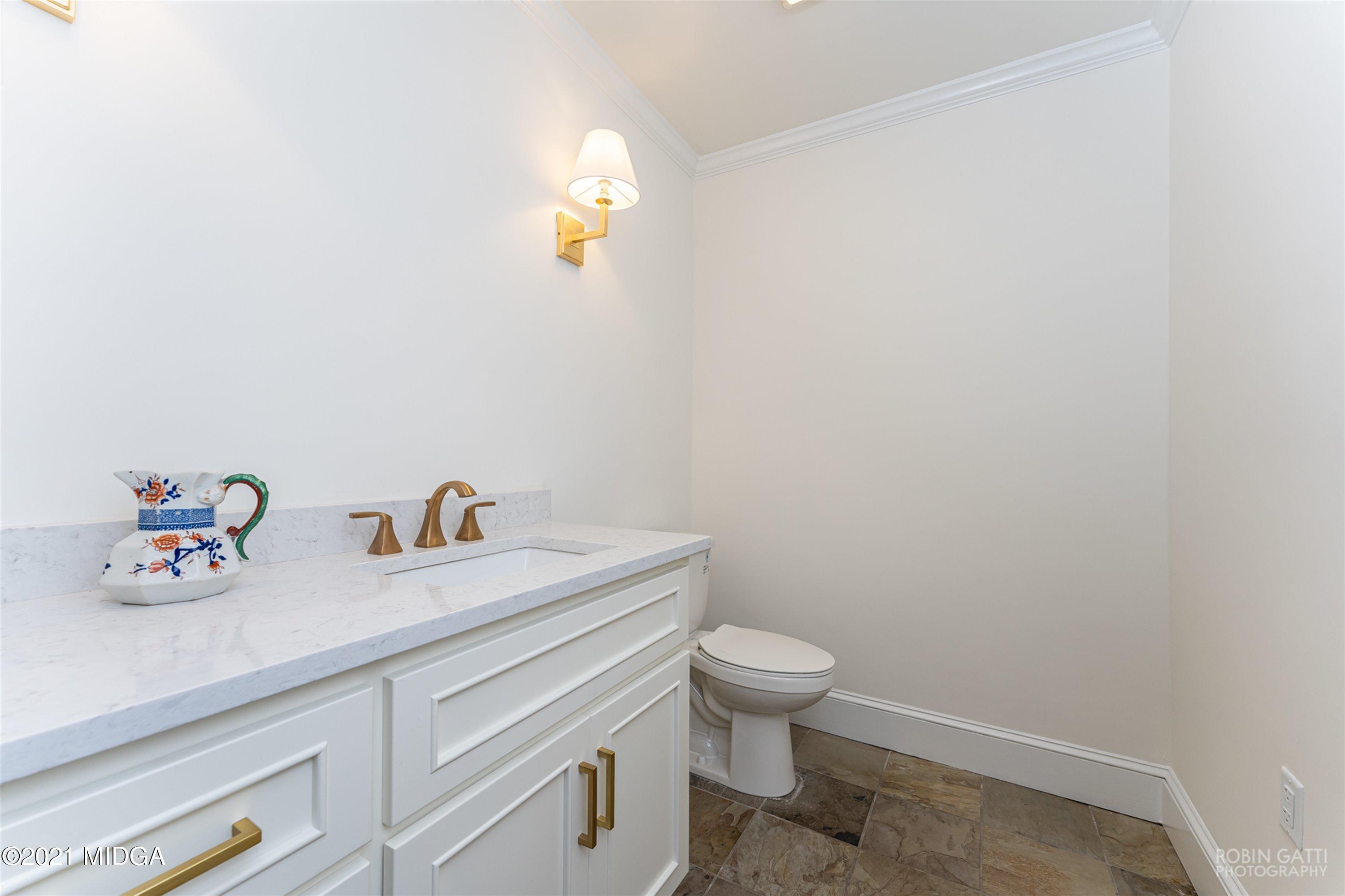 2569 Maynards Mill Road Forsyth, GA 31029 - Photo 49 of 67 a bathroom with a sink and a toilet