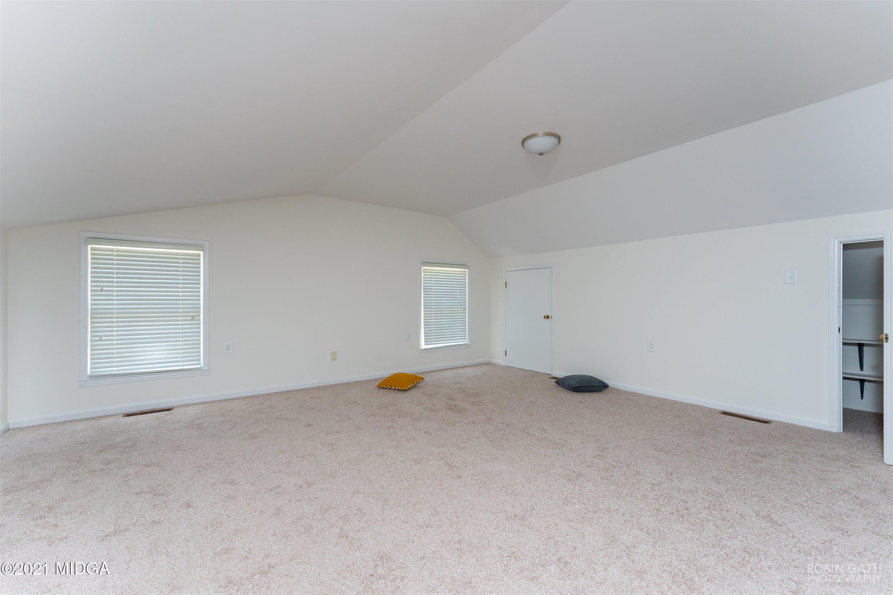 2569 Maynards Mill Road Forsyth, GA 31029 - Photo 50 of 67 an empty room with a natural light