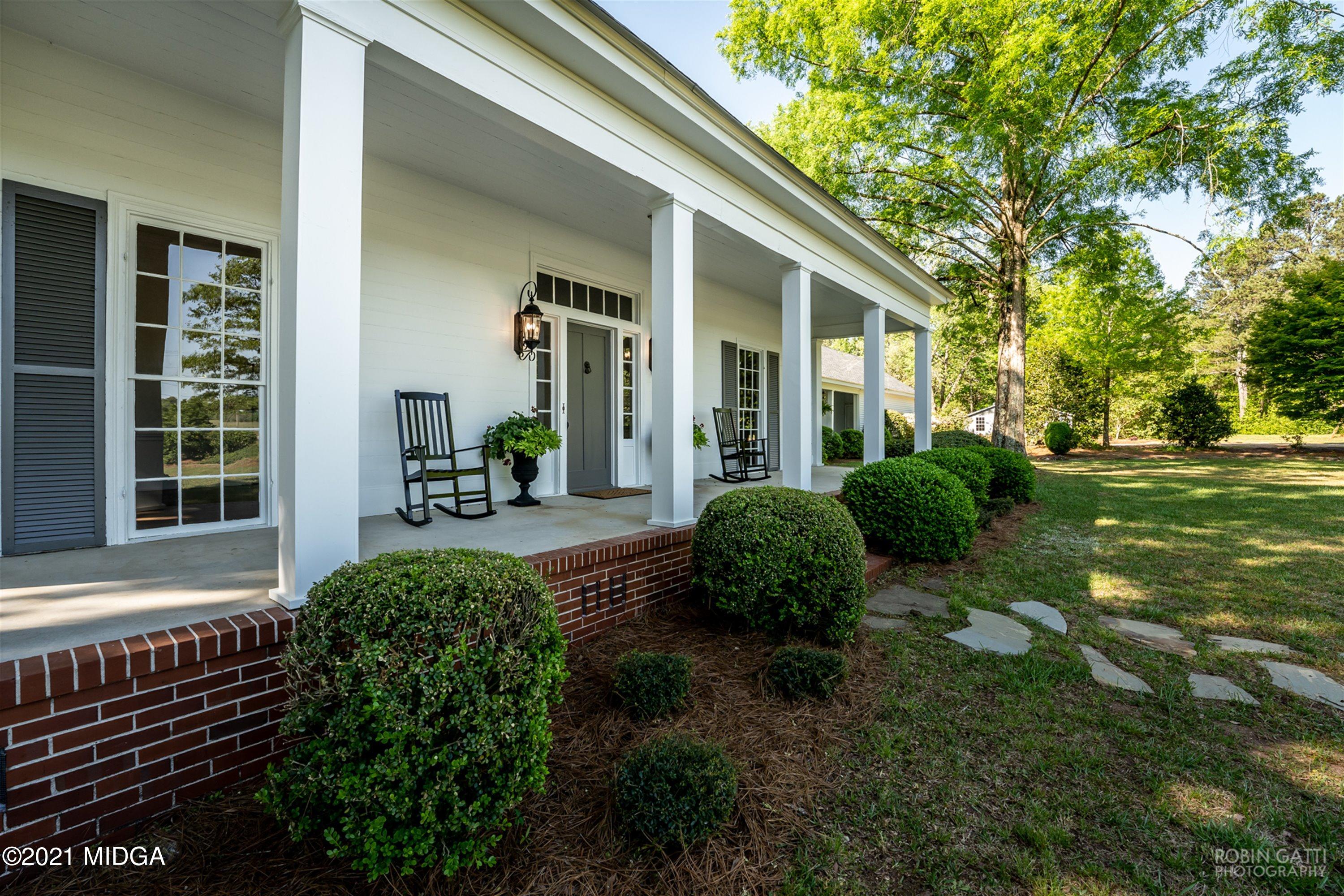 2569 Maynards Mill Road Forsyth, GA 31029 - Photo 6 of 67 a view of a house with backyard and garden