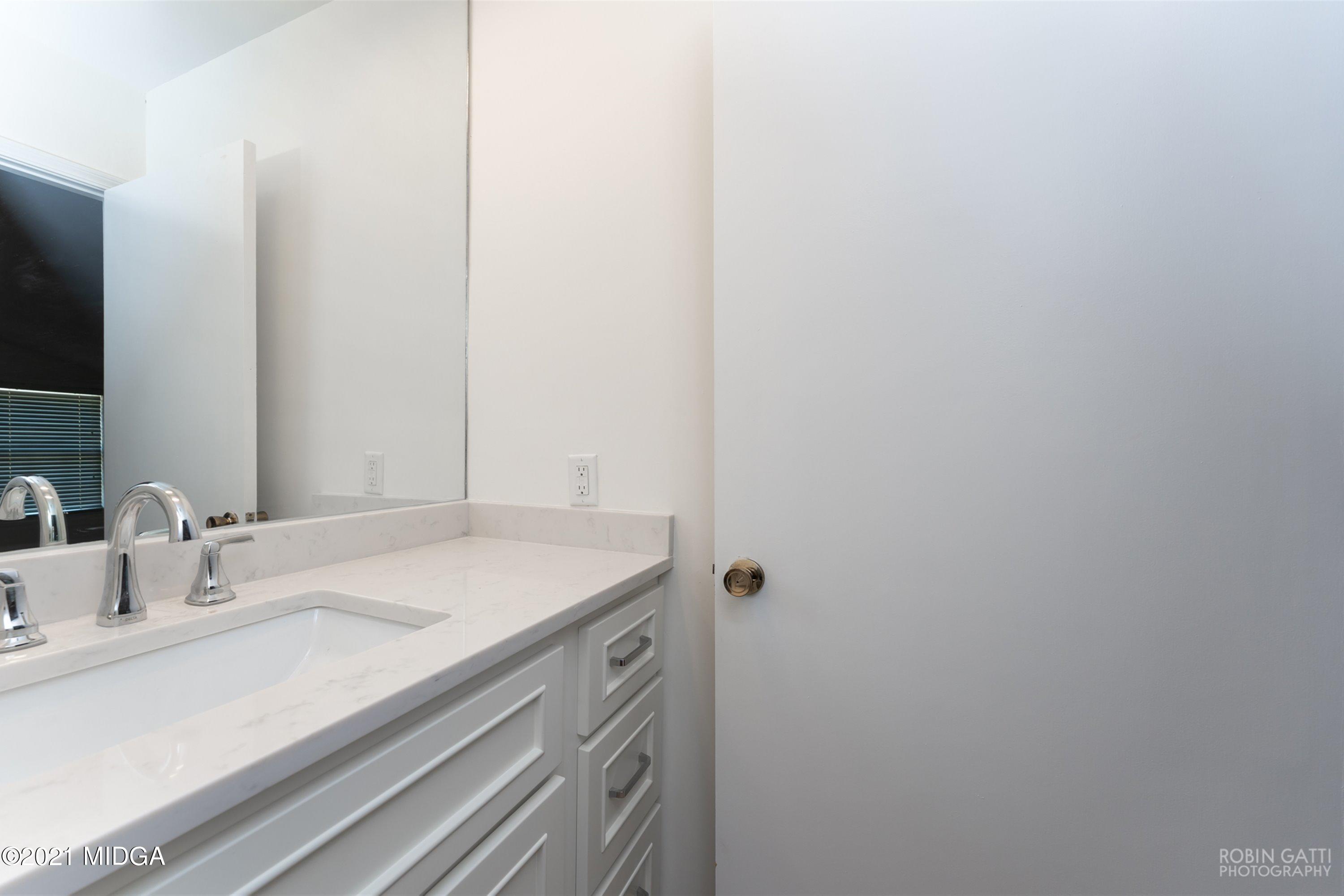 2569 Maynards Mill Road Forsyth, GA 31029 - Photo 51 of 67 a bathroom with a sink and a mirror