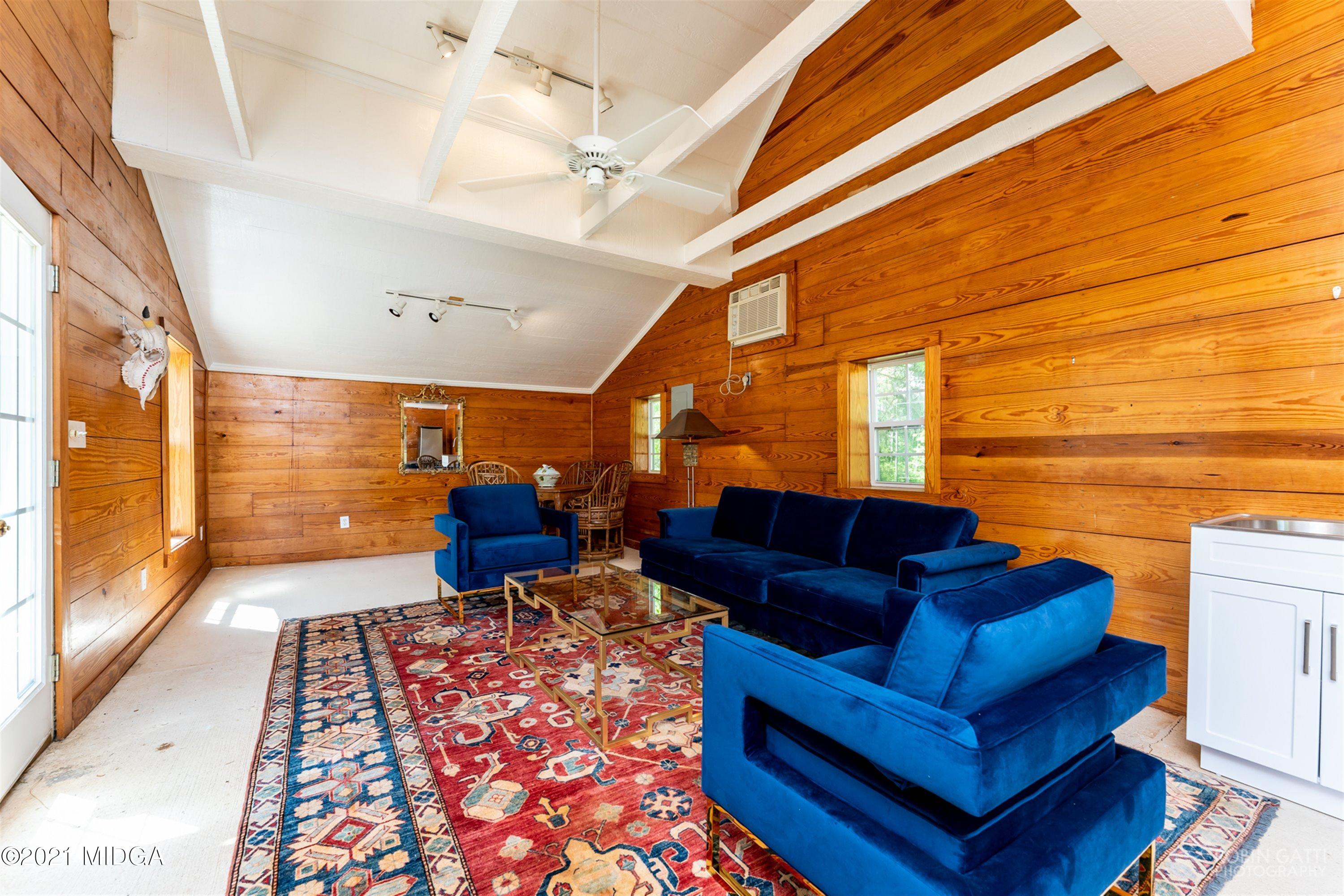 2569 Maynards Mill Road Forsyth, GA 31029 - Photo 53 of 67 a living room with furniture and a rug