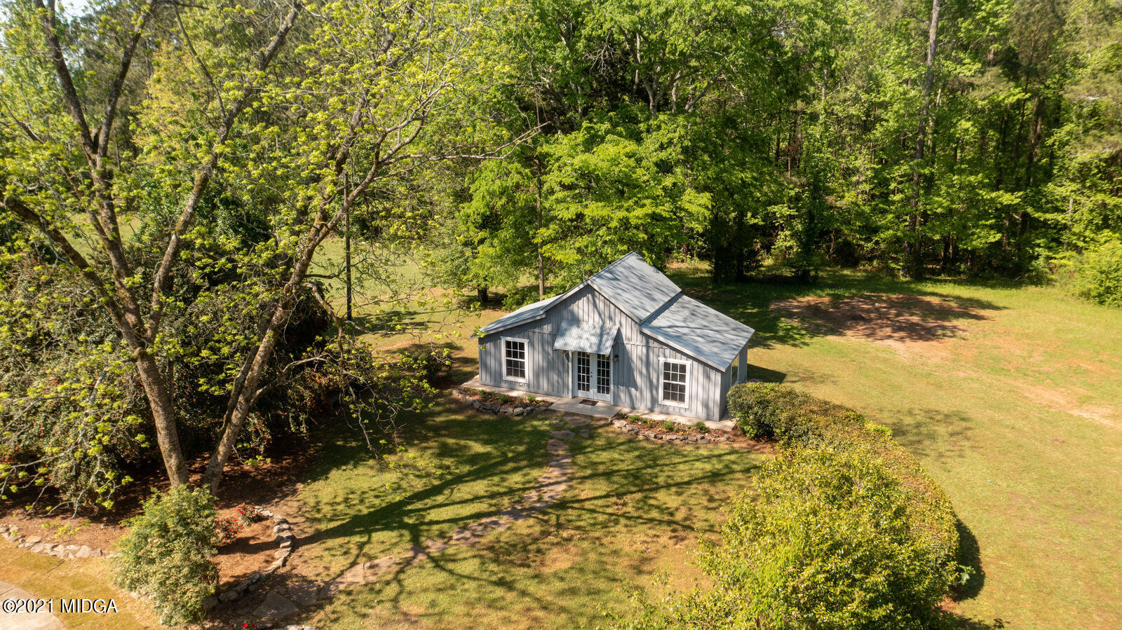 2569 Maynards Mill Road Forsyth, GA 31029 - Photo 57 of 67 a view of a house with a yard