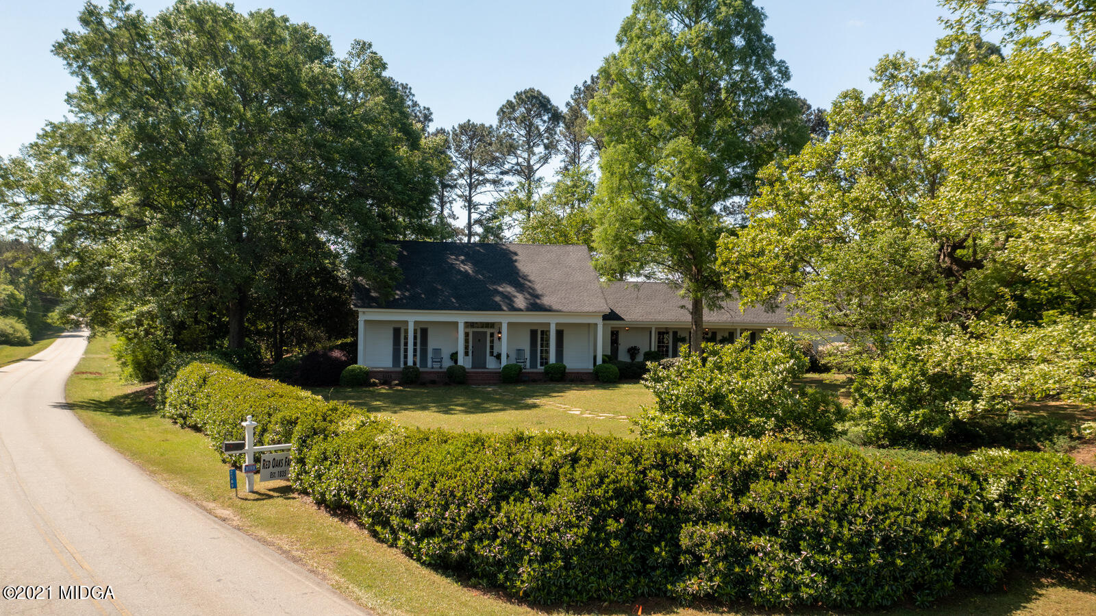 2569 Maynards Mill Road Forsyth, GA 31029 - Photo 59 of 67 a view of a house with swimming pool next to a yard