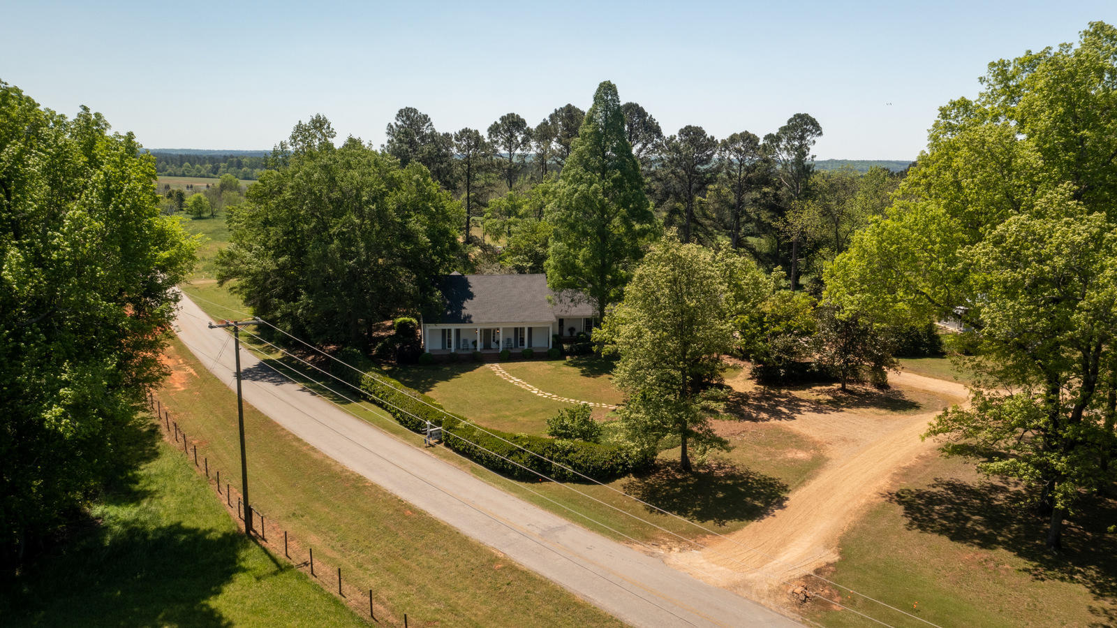 2569 Maynards Mill Road Forsyth, GA 31029 - Photo 66 of 67 a view of a house with a yard and sitting area