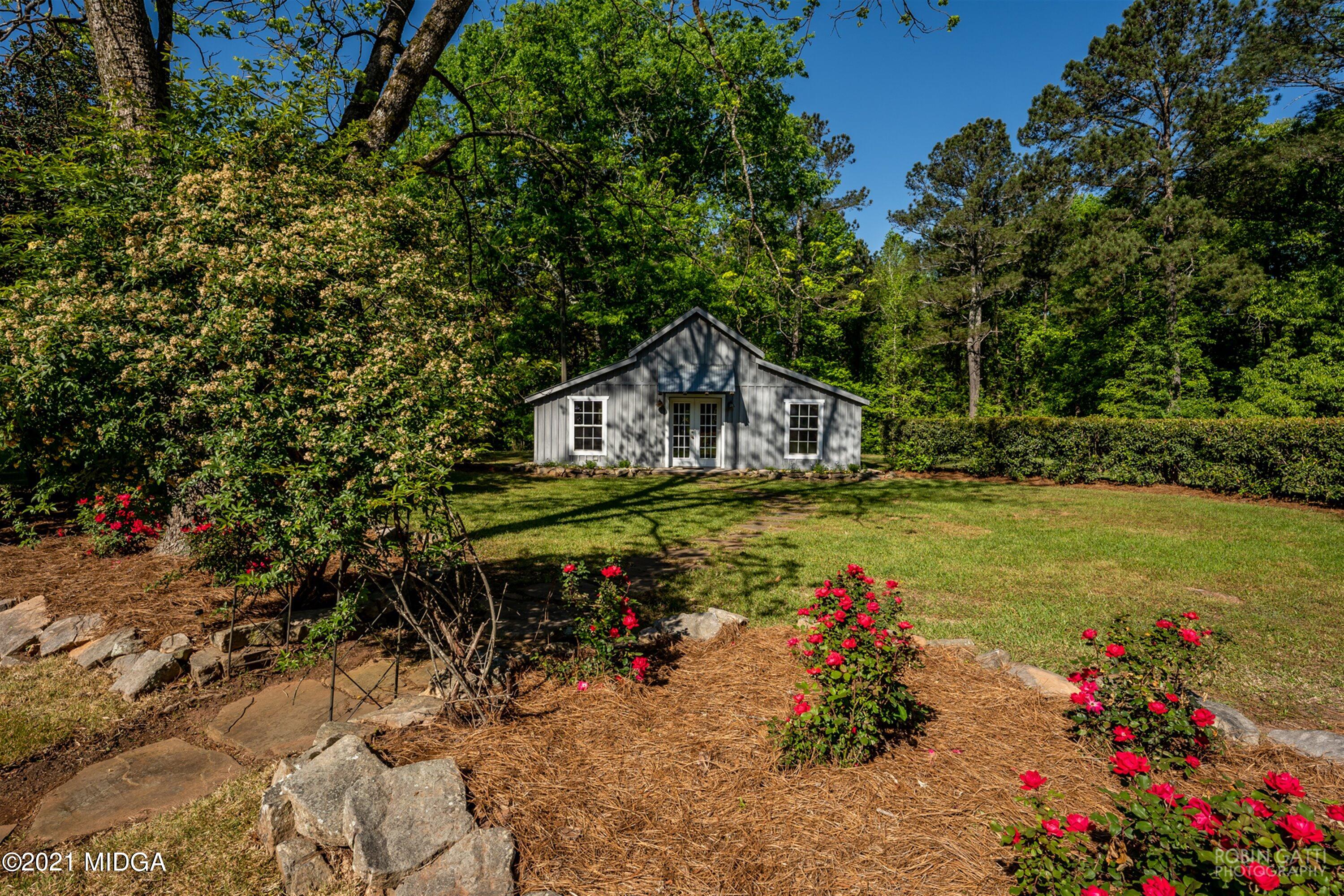 2569 Maynards Mill Road Forsyth, GA 31029 - Photo 9 of 67 a view of a house with swimming pool