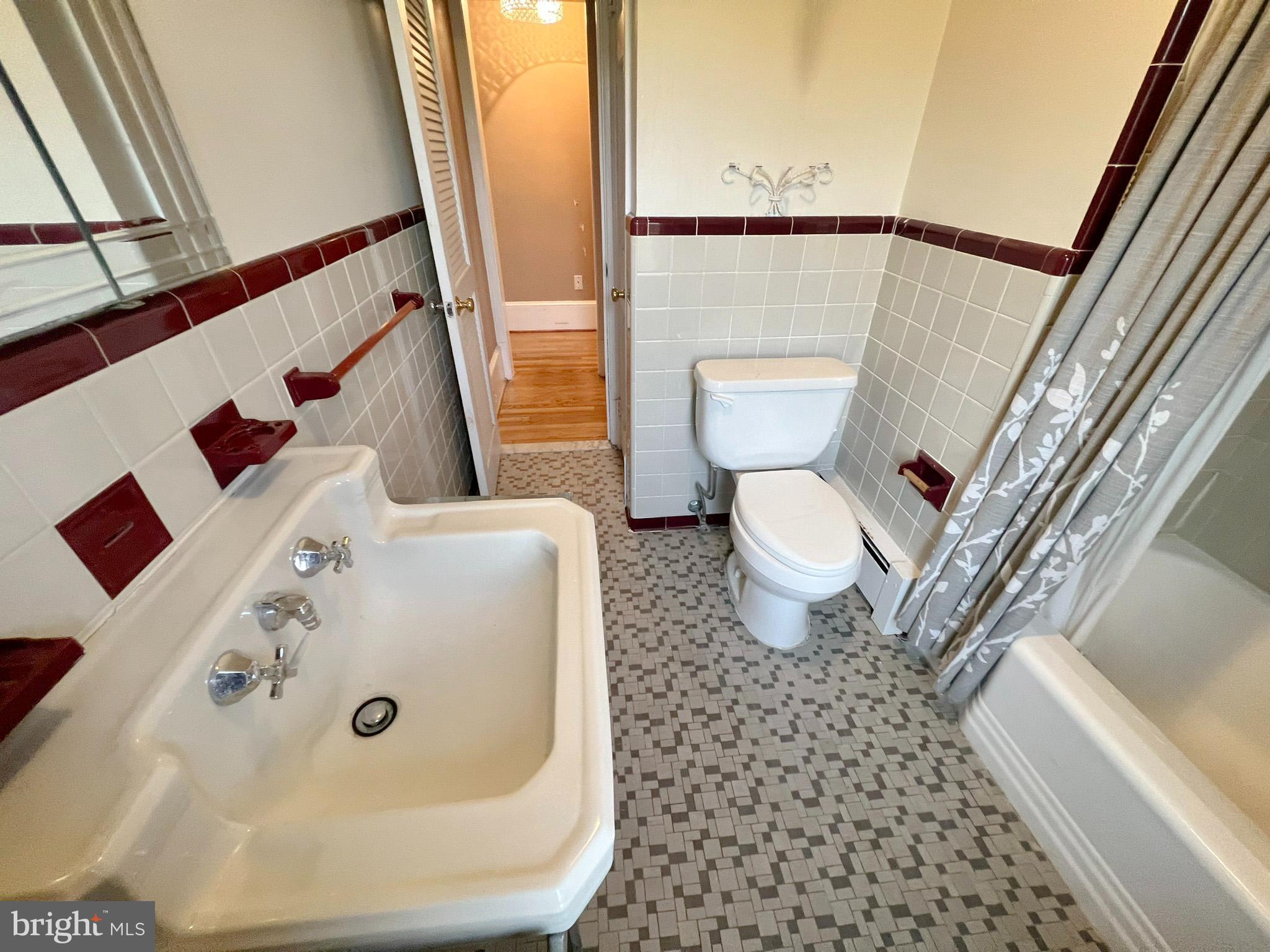 800 Church Hill Road Centreville, MD 21617 - Photo 13 of 19 a white toilet sitting next to a bathroom sink and a tub