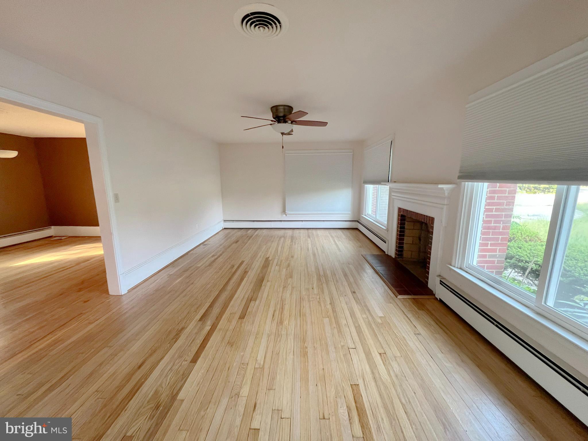 800 Church Hill Road Centreville, MD 21617 - Photo 5 of 19 wooden floor in an empty room with a window