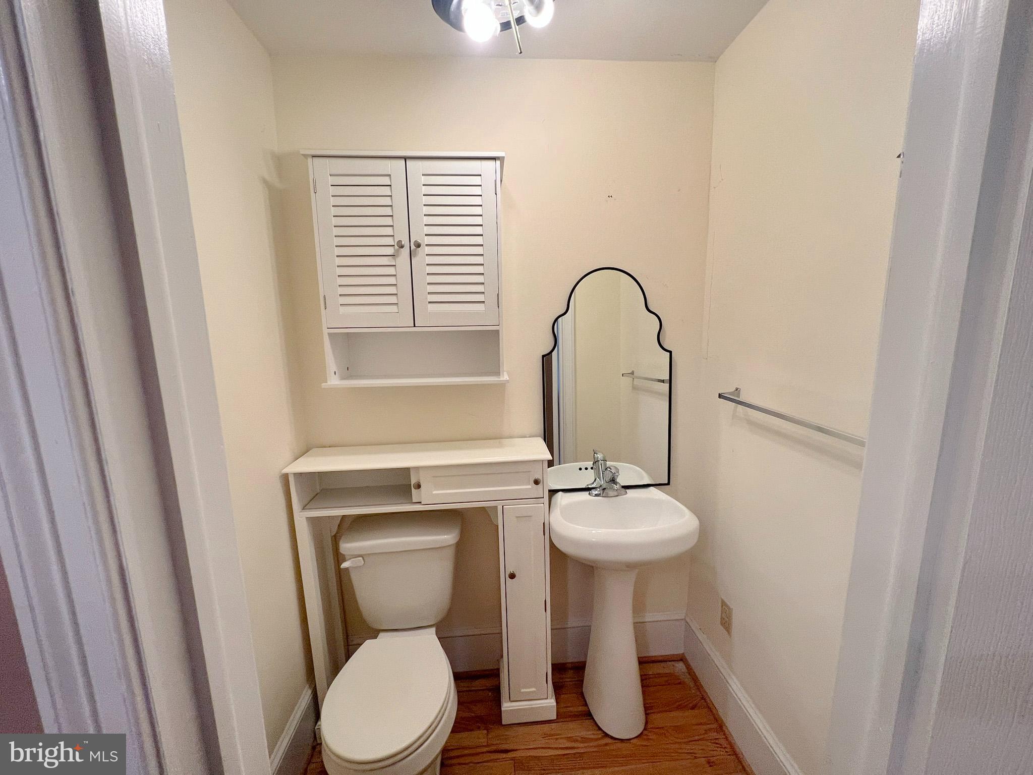 800 Church Hill Road Centreville, MD 21617 - Photo 10 of 19 a bathroom with a toilet a sink and a window