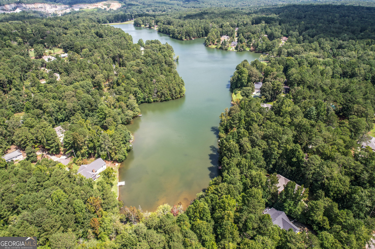 an aerial view of lake houses with outdoor space