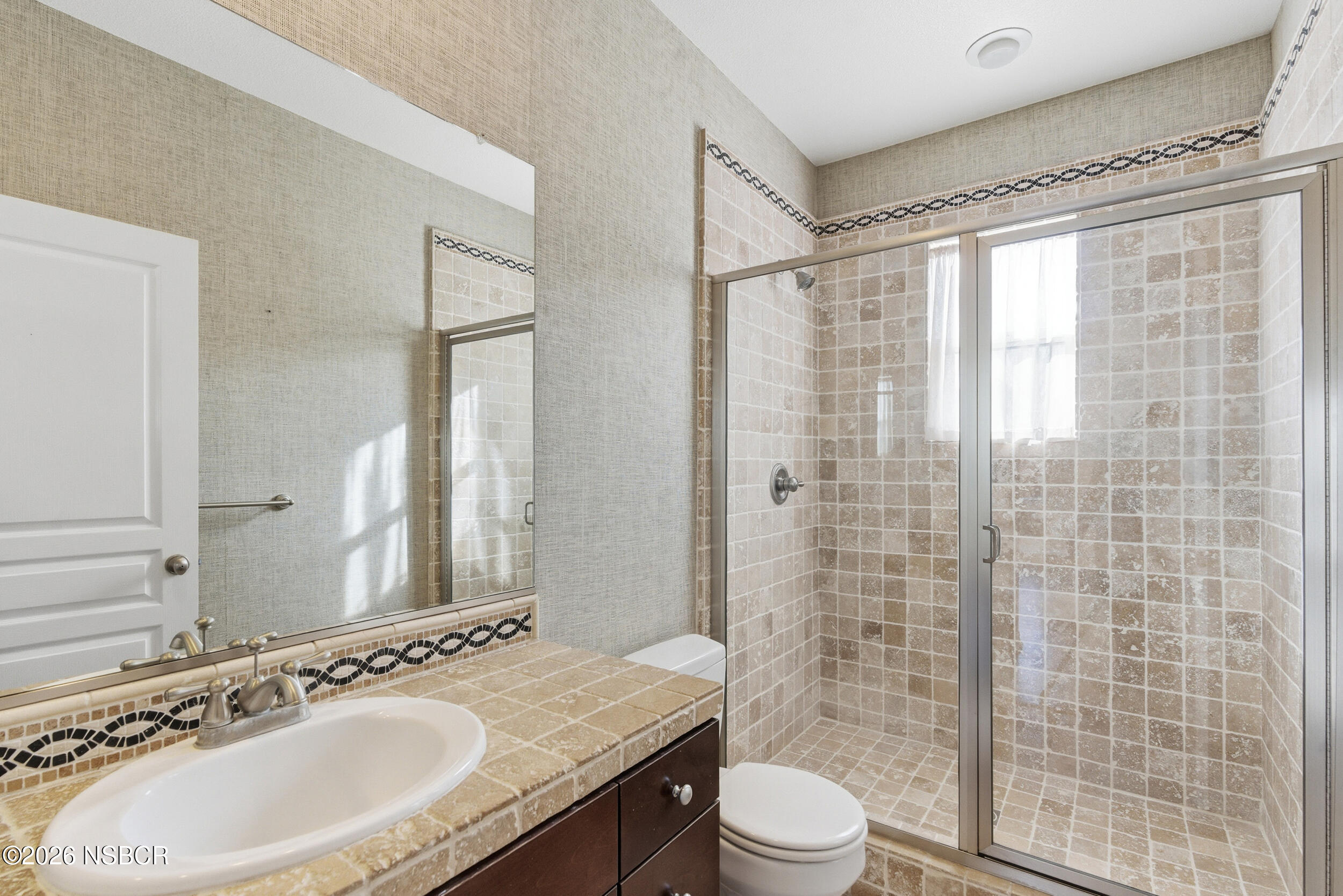 5632 Menemsha Lane Santa Maria, CA 93455 - Photo 26 of 66 a bathroom with a sink a toilet and shower