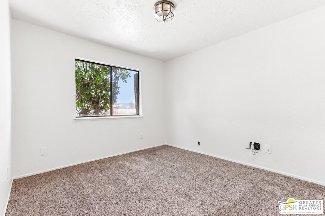 13819 Rivers Edge Road Helendale, CA 92342 - Photo 17 of 31 an empty room with a window