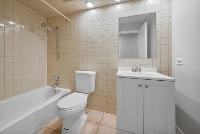 a bathroom with a toilet sink shower and bathtub