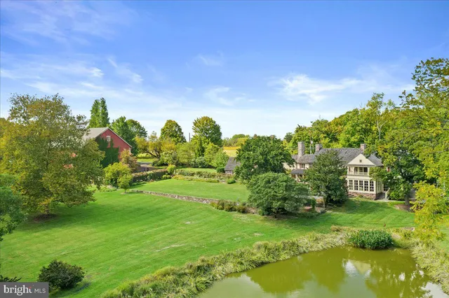 a view of a garden with a house