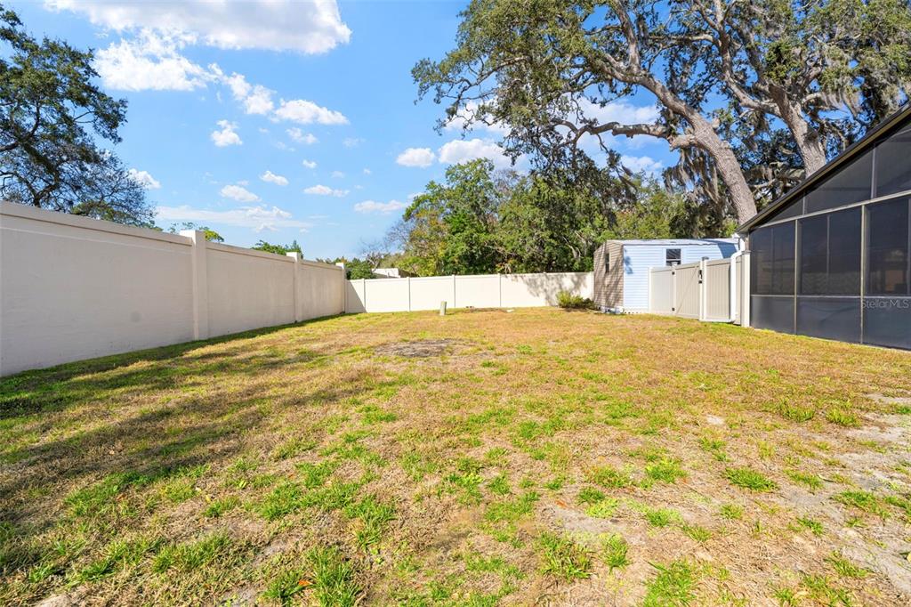 2399 Gallagher Avenue Spring Hill, FL 34606 - Photo 14 of 56 a view of a yard with a house