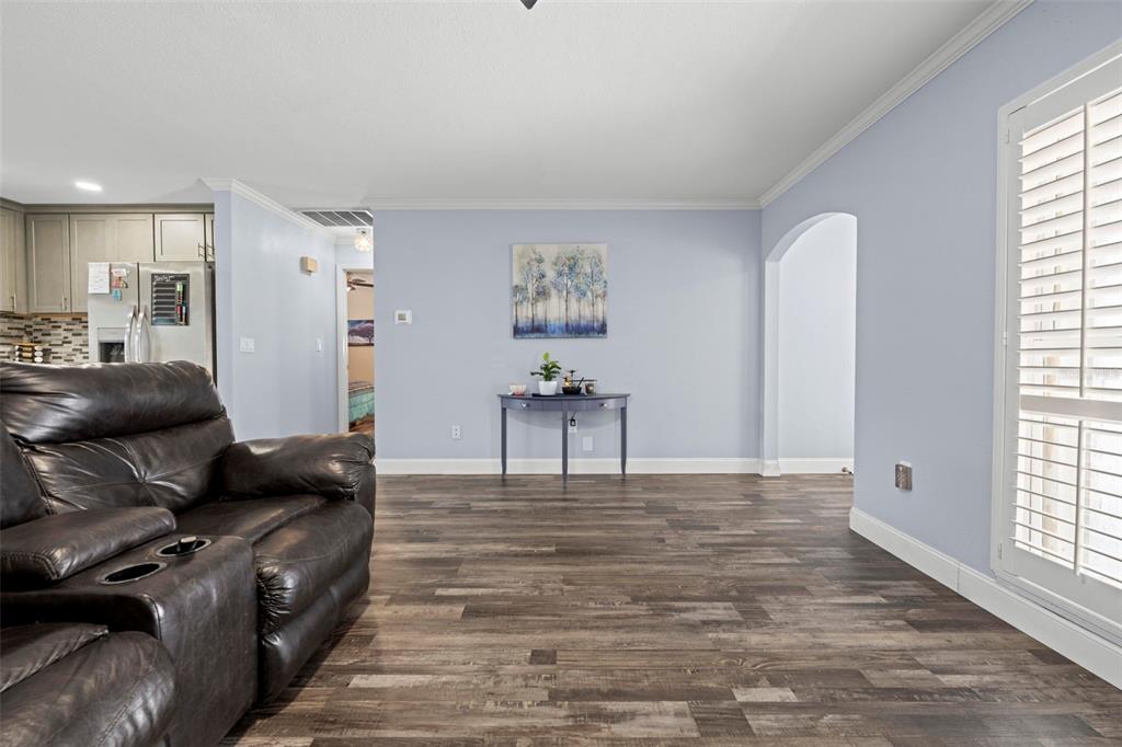 2399 Gallagher Avenue Spring Hill, FL 34606 - Photo 28 of 56 a living room with furniture and a large window