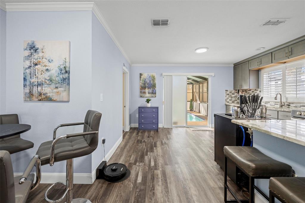 2399 Gallagher Avenue Spring Hill, FL 34606 - Photo 40 of 56 a living room with furniture and wooden floor