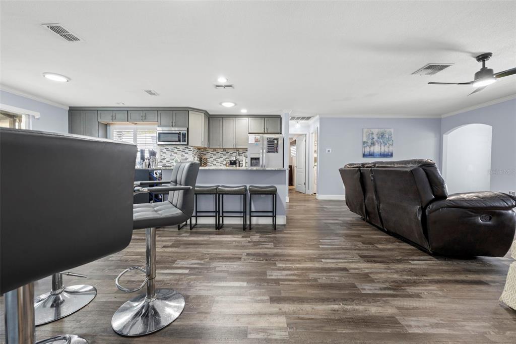 2399 Gallagher Avenue Spring Hill, FL 34606 - Photo 46 of 56 a living room with furniture and wooden floor
