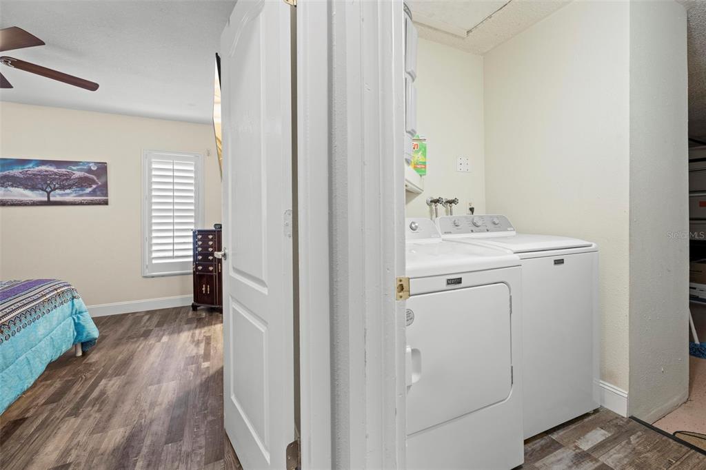 2399 Gallagher Avenue Spring Hill, FL 34606 - Photo 50 of 56 a view of a hallway with wooden floor and closet