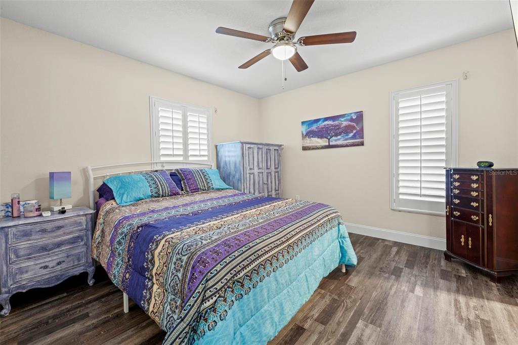 2399 Gallagher Avenue Spring Hill, FL 34606 - Photo 51 of 56 a bedroom with a bed and a bookshelf