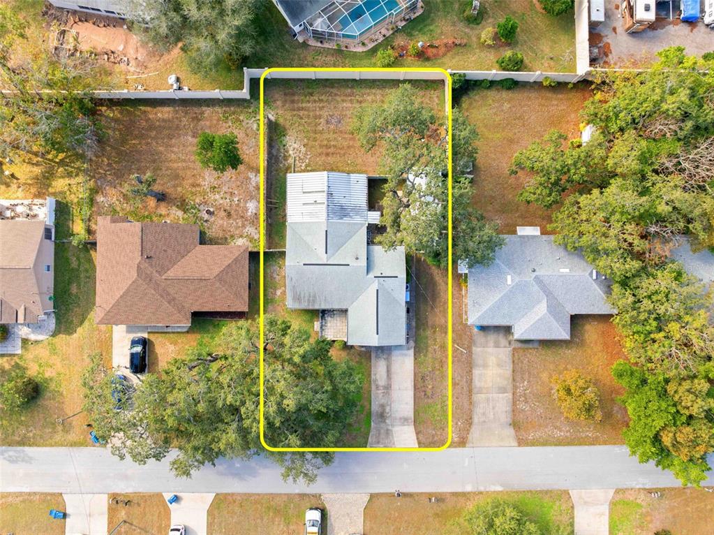 2399 Gallagher Avenue Spring Hill, FL 34606 - Photo 7 of 56 an aerial view of residential houses with outdoor space