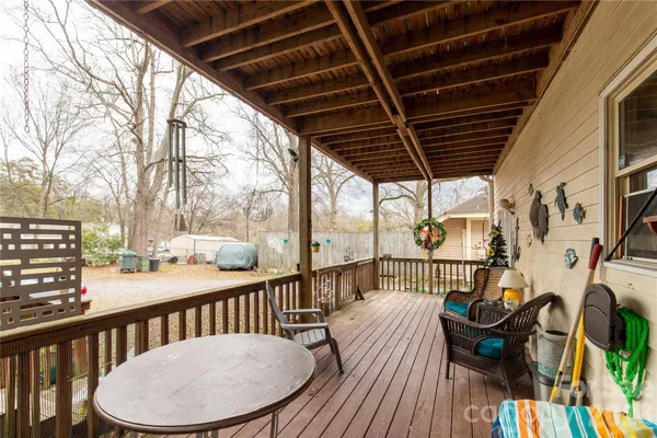 a view of a balcony with furniture