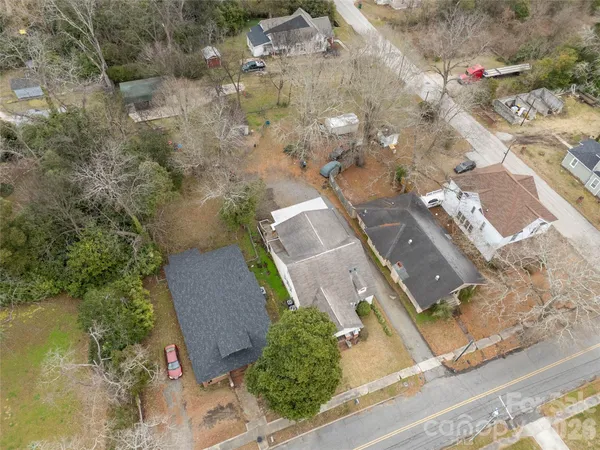 an aerial view of a house with outdoor space