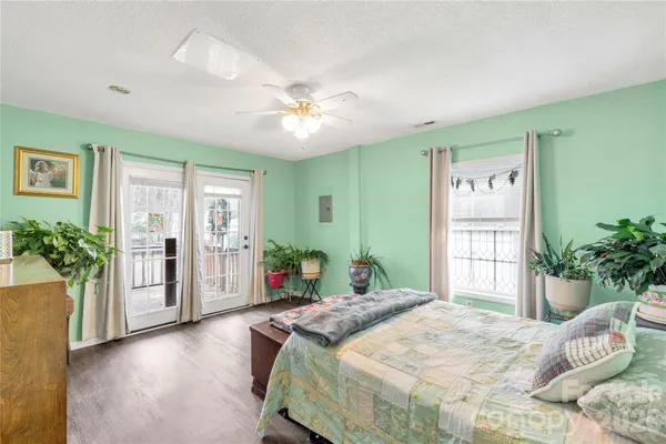 a bedroom with a large bed and a large window