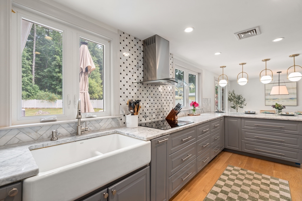 57 Marlboro Road Sudbury, MA 01776 - Photo 3 of 40 a kitchen with a sink stove and cabinets