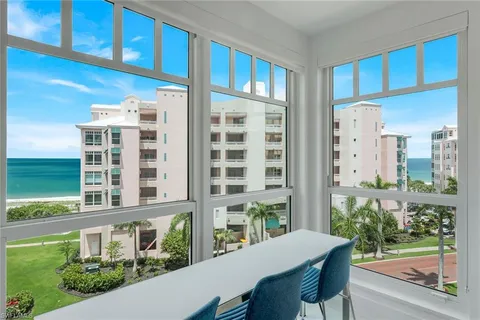 a view of a balcony dining table and chairs
