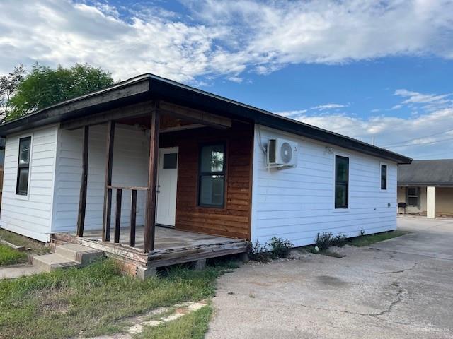 221 East Cherokee Avenue Pharr, TX 78577 - Photo 2 of 8 a front view of a house with a yard