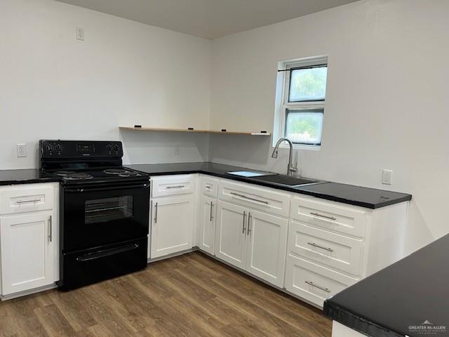 221 East Cherokee Avenue Pharr, TX 78577 - Photo 4 of 8 a kitchen with granite countertop a stove and a sink