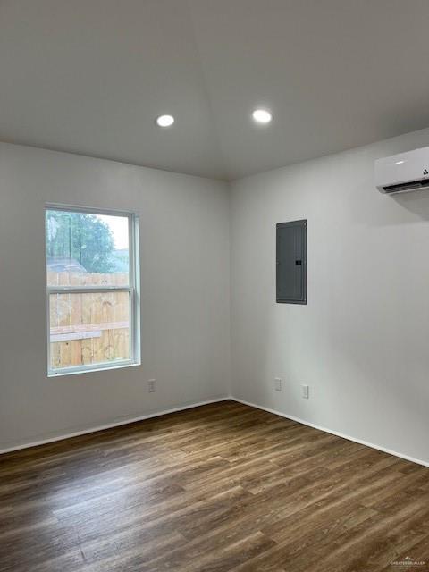 221 East Cherokee Avenue Pharr, TX 78577 - Photo 6 of 8 an empty room with wooden floor and windows