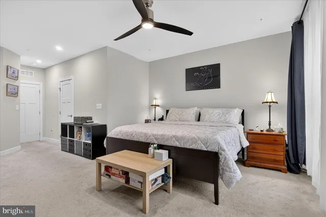 a bed room with a bed and a dresser