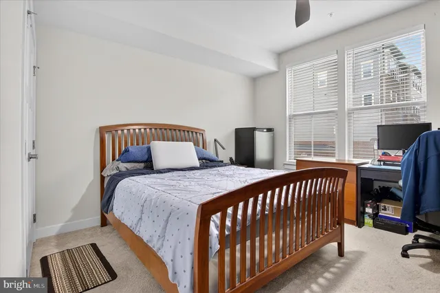 a bedroom with a bed and a tv in it