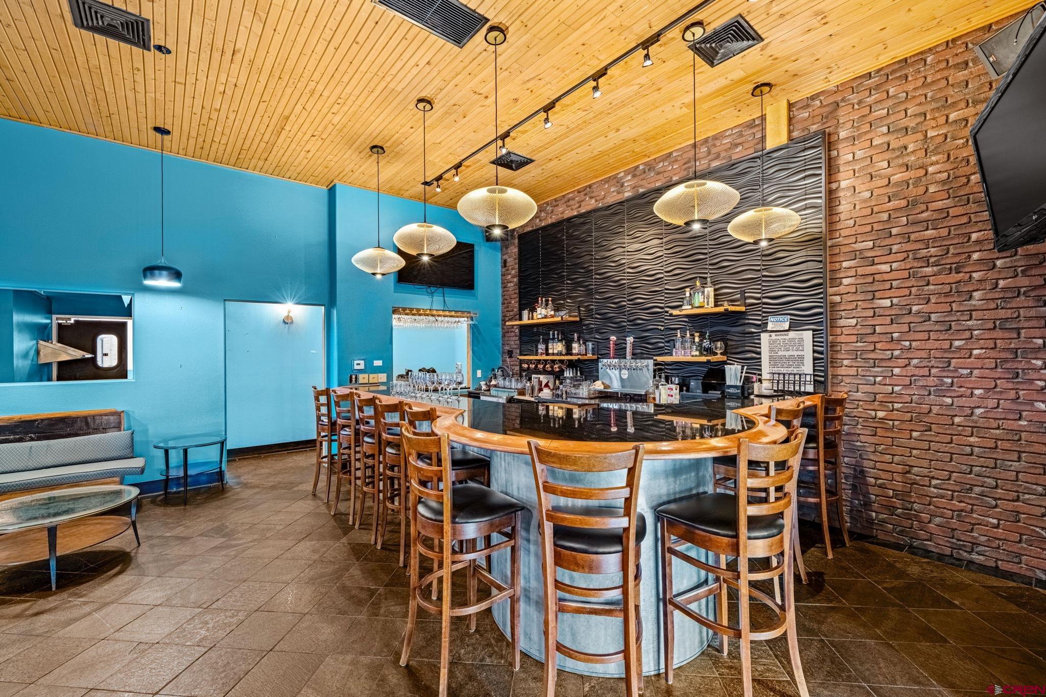 701 East 2nd Avenue Durango, CO 81301 - Photo 12 of 39 a view of a dining room with furniture and chandelier