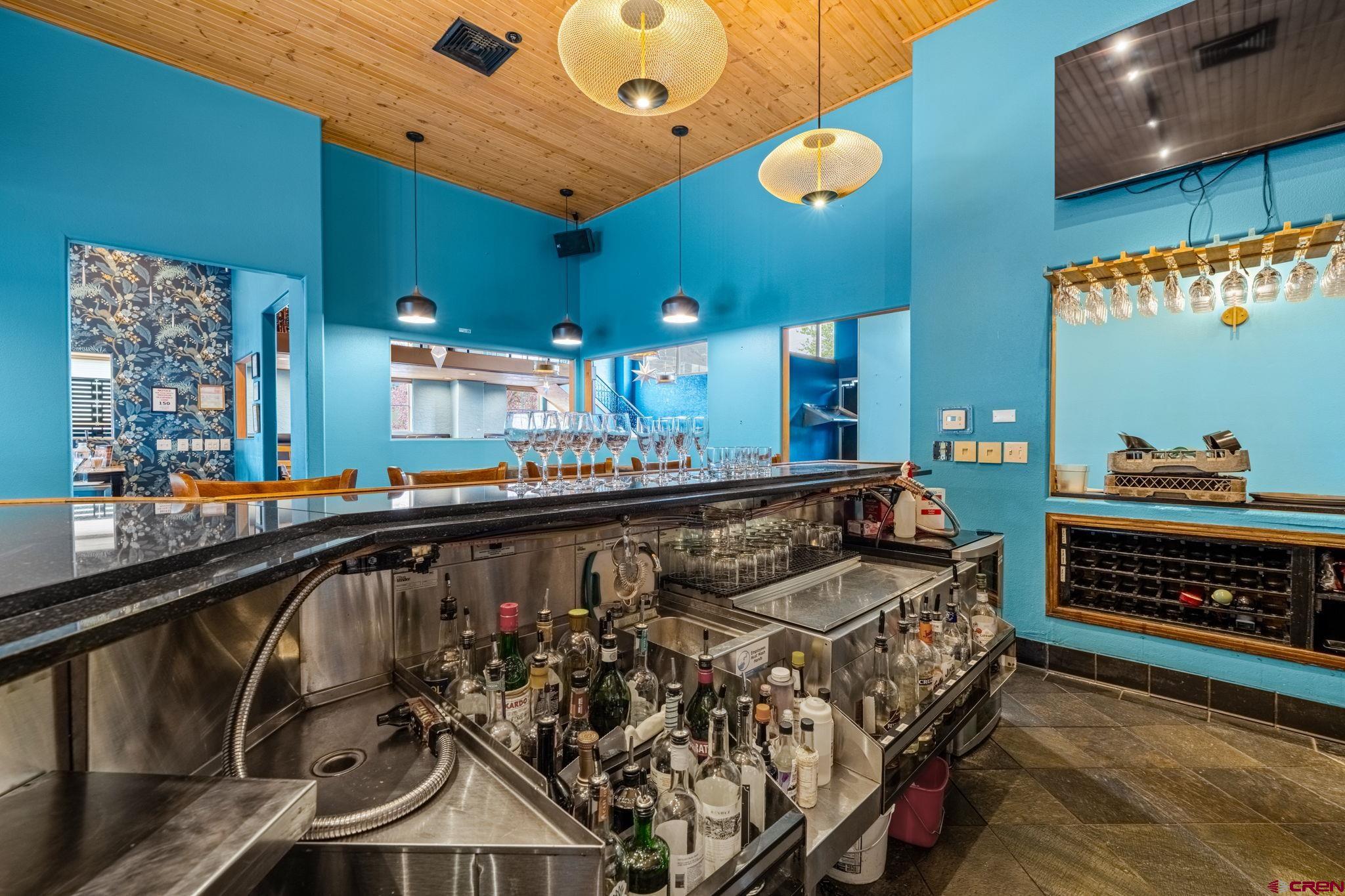 701 East 2nd Avenue Durango, CO 81301 - Photo 14 of 39 a bed room with a bed and a television