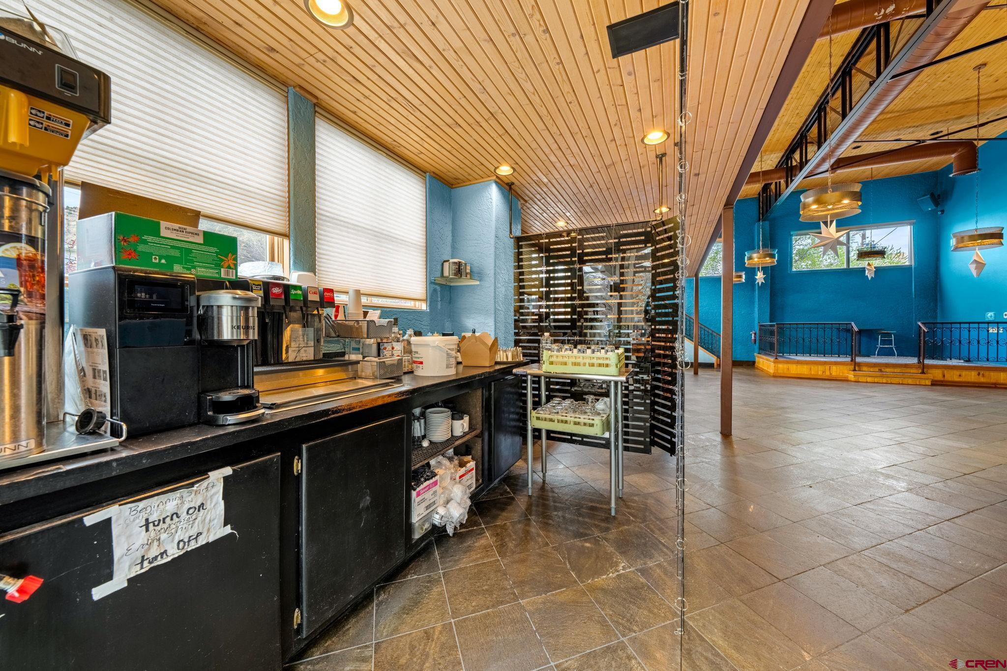 701 East 2nd Avenue Durango, CO 81301 - Photo 18 of 39 a kitchen with stainless steel appliances a sink and cabinets