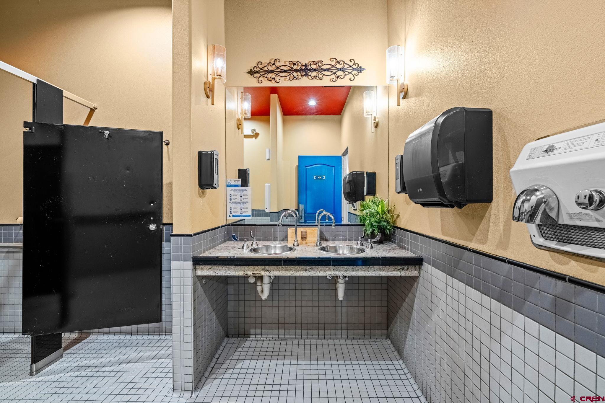 701 East 2nd Avenue Durango, CO 81301 - Photo 19 of 39 a kitchen with a sink and a refrigerator
