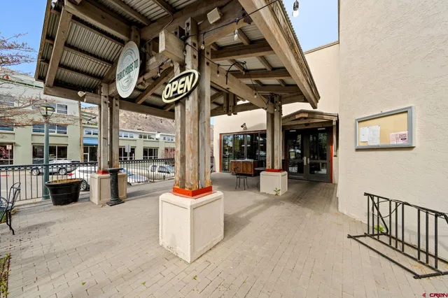 a view of a chairs and tables in patio and a kitchen
