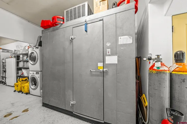 a view of a patio with couches table and chairs and potted plants