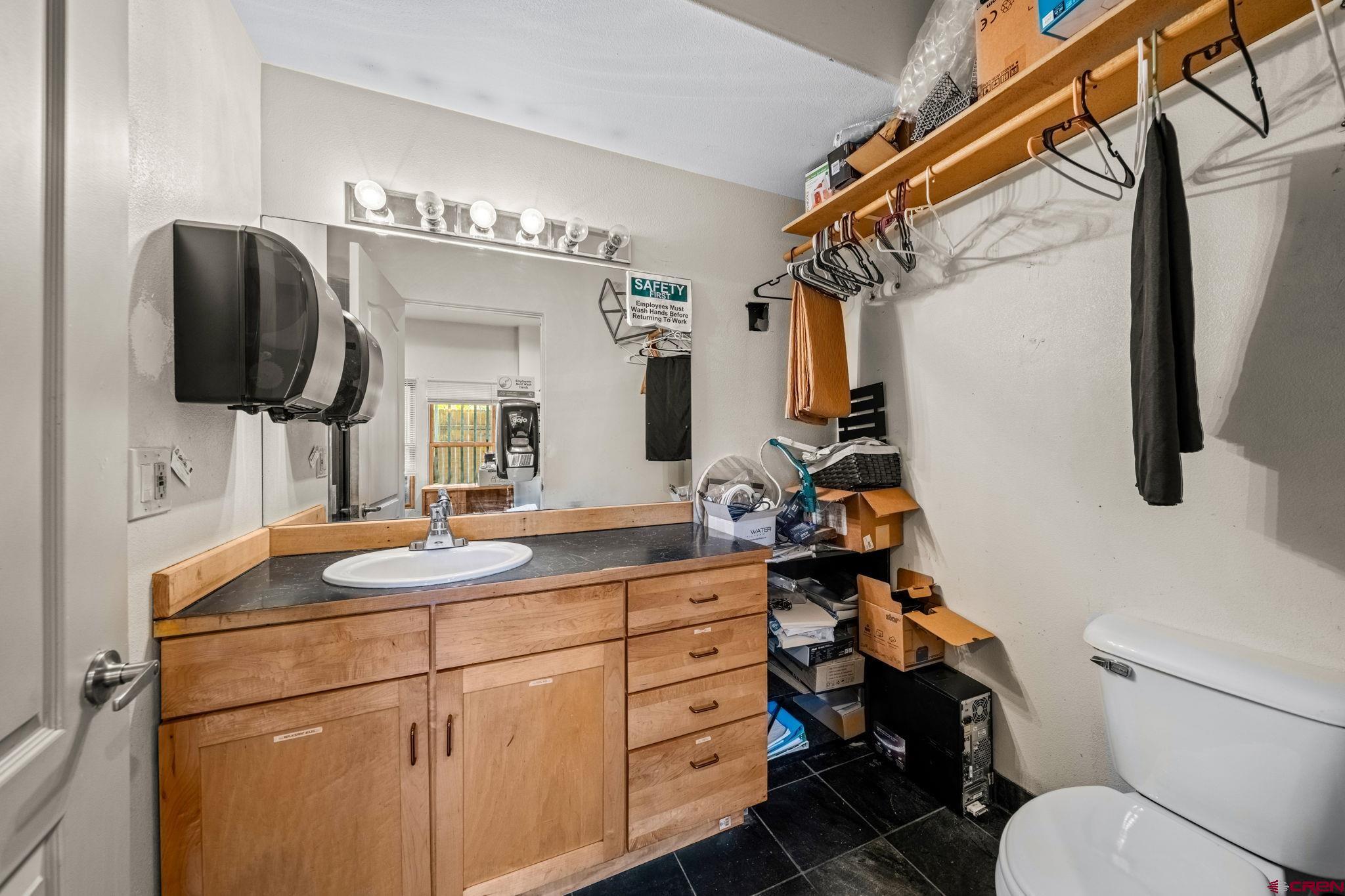 701 East 2nd Avenue Durango, CO 81301 - Photo 33 of 39 a bathroom with a toilet sink and mirror