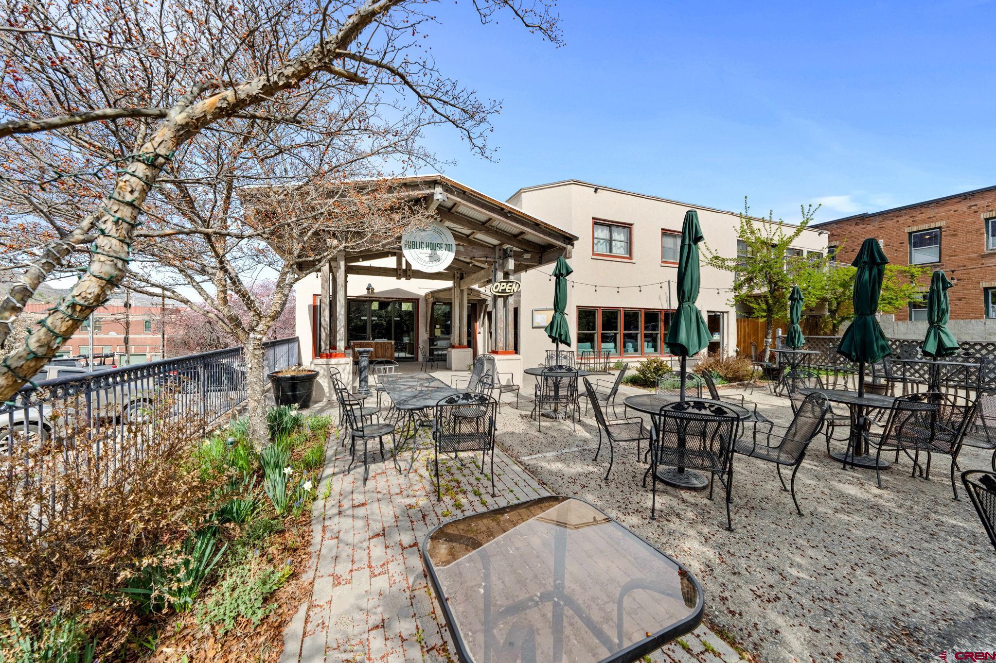 701 East 2nd Avenue Durango, CO 81301 - Photo 35 of 39 a view of a patio with couches table and chairs and potted plants