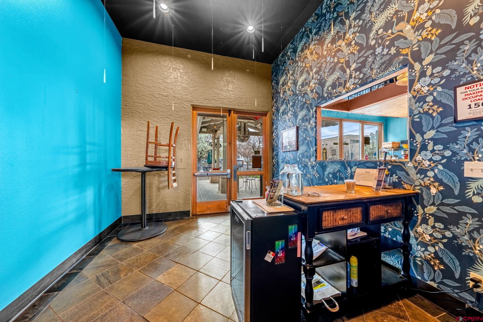 701 East 2nd Avenue Durango, CO 81301 - Photo 4 of 39 a patio with glass top table and chairs