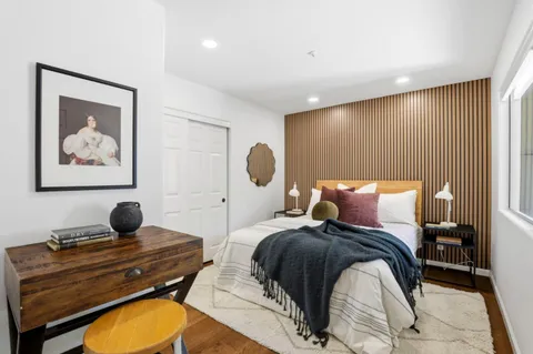a bedroom with a bed and window