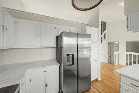 a kitchen with stainless steel appliances refrigerator and cabinets