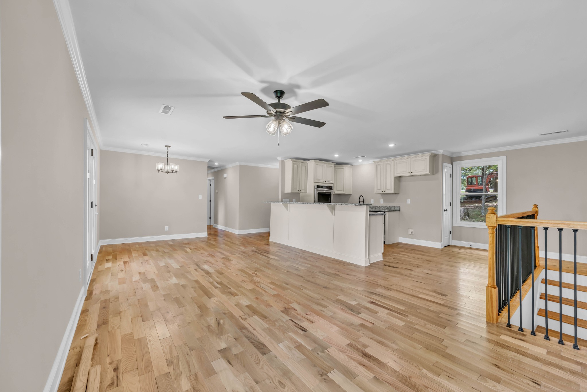 a view of kitchen with cabinets and wooden floor